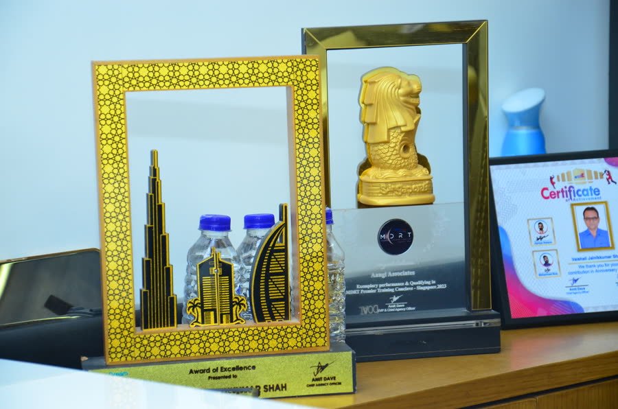 MDRT and TATA AIA award trophies at the Aangi Associates office